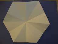 Refold your hexagon back into the triangle you previously created