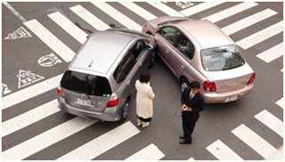 A man and woman after a car accident.