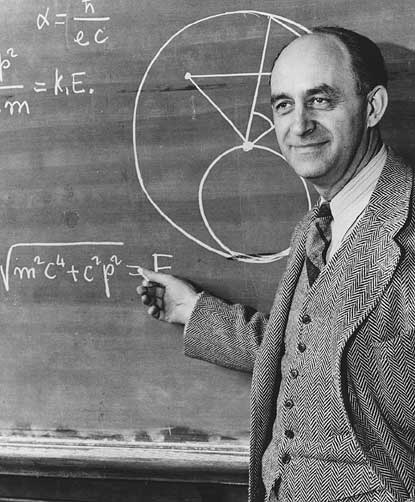 This picture of Enrico Fermi, appearing on a recently issued stamp, contains, in the upper left corner, an incorrect formula for alpha. Proving that even Nobel Laureates make mistakes… (Credit: University of Chicago, courtesy AIP Emilio Segre Visual Archives.)