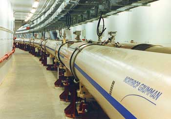 The twin curved tubes at RHIC that contain the counterrotating gold beams, which can be brought together to collide at six instrumented areas around the ring. 