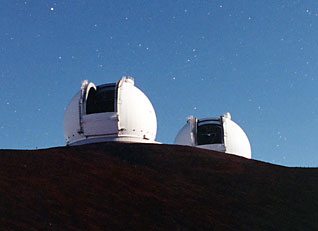 The twin Keck telescopes, one optical and one infrared, on the Mauna Kea volcano in Hawaii (photo courtesy W. M. Keck Observatory)