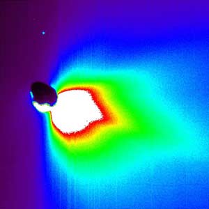 Comet Tempel 1 about 50 minutes after impact, as seen in false color by the flyby spacecraft.