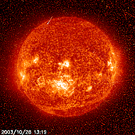  Another view of the powerful solar flare of October 28, 2003, again in the extreme ultraviolet. The glitter is noise in the detector from a blast of charged particles associated with the flare. (image courtesy of NASA)