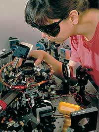 Physicist Deborah Jin of the National Institute for Standards and Technology (NIST) aligning an infrared laser in apparatus designed to create a Bose-Einstein Condensate of rubidium atoms