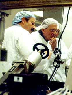 Charles Falco and David Hockney with Molecular Beam Epitaxy machine.