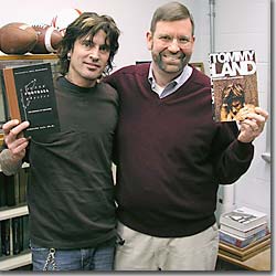 Tommy Lee and Timothy Gay with books.