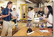 Andrew Post-Zwicker debating with student during a special program for high school girls interested in science.