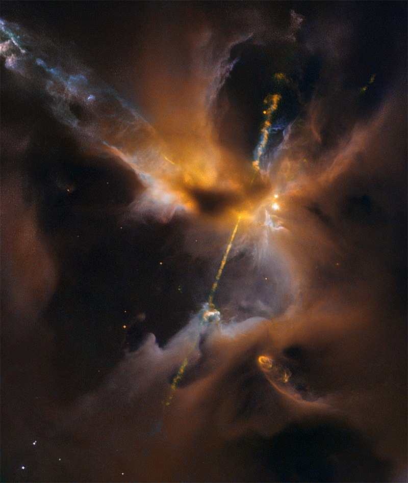 Two narrow jets of highly energized particles erupt from the poles of a nascent star in the constellation Orion