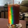 Light refracts through an empty glass to produce a rainbow of color