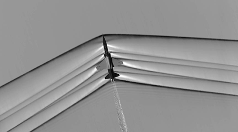 A shockwave spreads from the tip of a supersonic jet