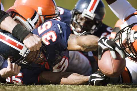 Hard tackles like the one shown here can lead to difficult-to-detect brain damage