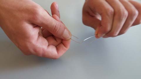 Physics at Home: A paper clip being bent back and forth to generate heat