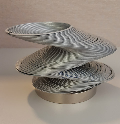 This otherwise-ordinary slinky can be made to hold an unusual shape by the magnet